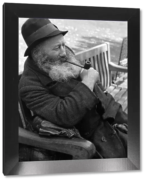 Portrait of an old man seen here smoking his pipe Circa 1938