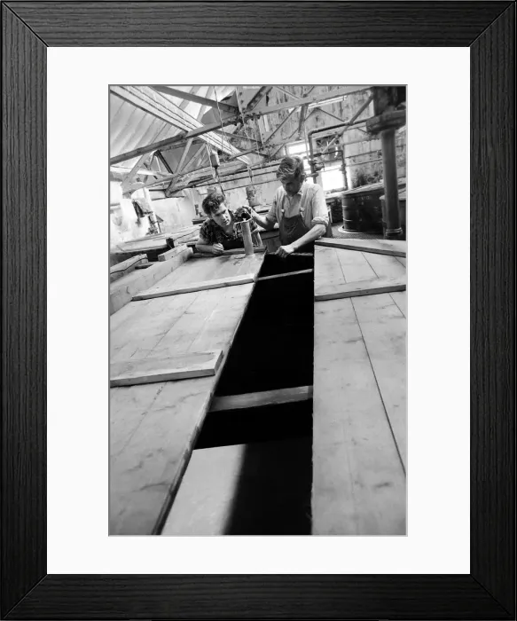 Framed Print : Workers inspect the malt grist in the Mash tun at the Knockando Whisky Distillery Framed Print : Workers inspect the malt grist in the Mash tun at the Knockando Whisky Distillery