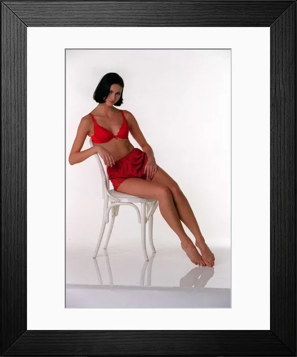 Framed Print : Model wearing Red Uplift Bra from La Senza and Red Satin Knickers from a selection by Framed Print : Model wearing Red Uplift Bra from La Senza and Red Satin Knickers from a selection by