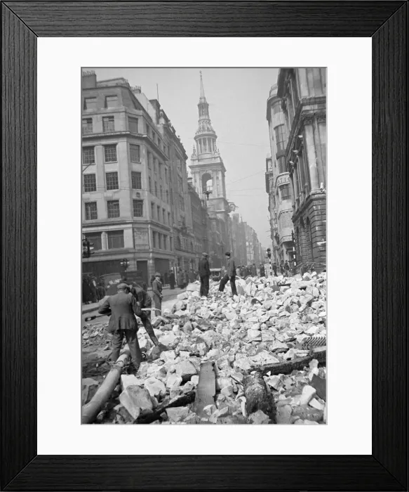 Framed Print : Workmen sift through the debris following the previous nights air raid on Central London Framed Print : Workmen sift through the debris following the previous nights air raid on Central London