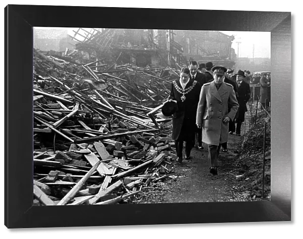 King George VI visits Birmingham to survey the bomb damage after a bombing raid in world