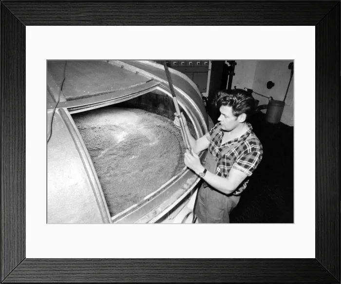Framed Print : A worker at the Knockando Whisky Distillery checks the Washback January 1972 Framed Print : A worker at the Knockando Whisky Distillery checks the Washback January 1972