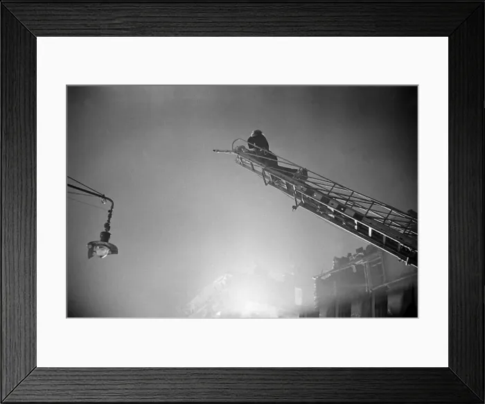 Framed Print : Fireman tackle a blaze in the Waterloo area cause by High Explosive bombs during the 2nd Framed Print : Fireman tackle a blaze in the Waterloo area cause by High Explosive bombs during the 2nd