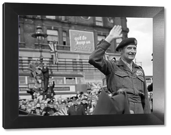 General Bernard Montgomery waves to the crowd on his way to Lambeth after World War Two