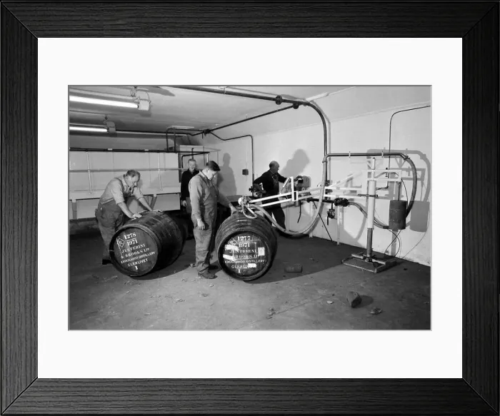 Framed Print : Whisky being filled in Sherry casks at the Knockando Whisky Distillery January 1972
