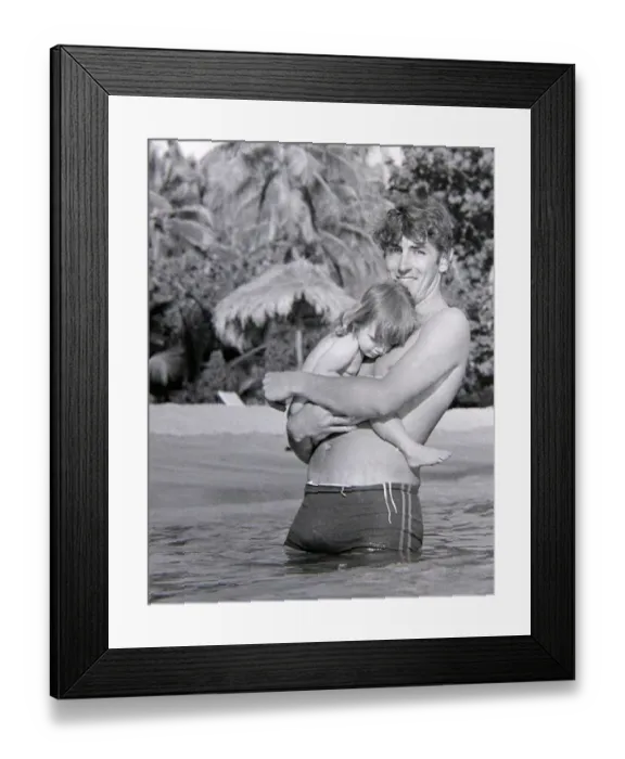 Framed Print : Comedian, actor and publisher Peter Cook with his daughter Lucy during a holiday in