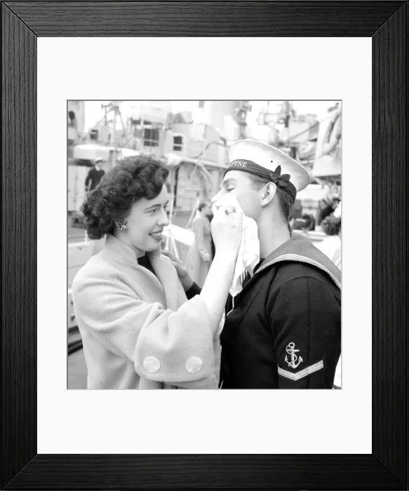 Framed Print : Dorothy Phillips wiping off the lipstick mark after kissing her boyfriend and sailor L. M Framed Print : Dorothy Phillips wiping off the lipstick mark after kissing her boyfriend and sailor L. M