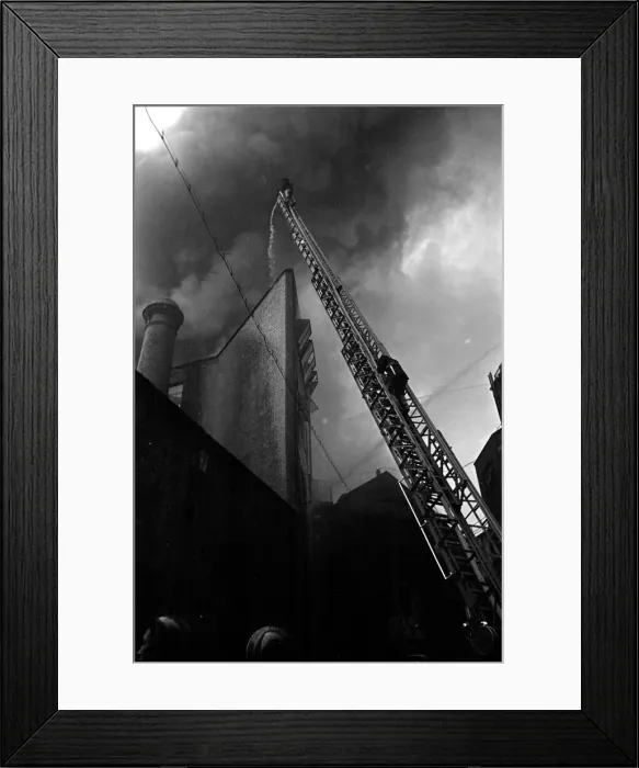 Framed Print : Firefighter tackle a fire following the V1 bombing of Brown Brothers in Great Eastern Framed Print : Firefighter tackle a fire following the V1 bombing of Brown Brothers in Great Eastern