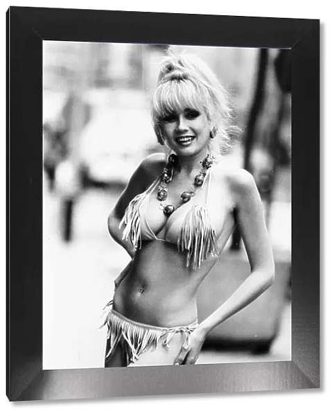 Louise Hobkinson Model dressed in bikini with long tassles