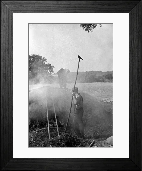 Framed Print : Two men burning peat in a field on a farm in England circa 1938 Framed Print : Two men burning peat in a field on a farm in England circa 1938
