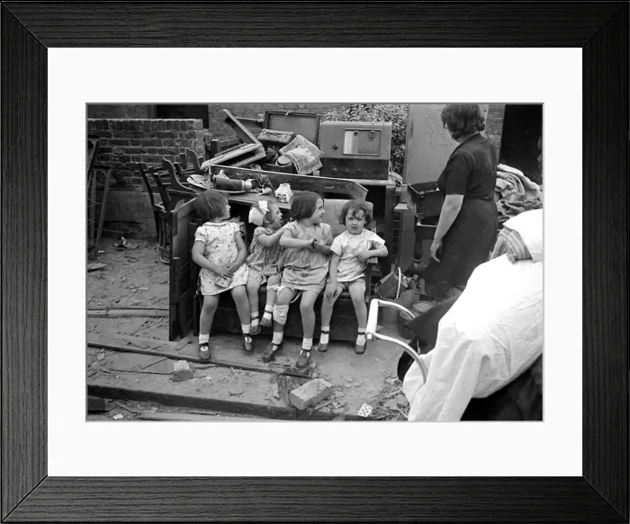 Framed Print : Mrs Rayner and children surrounded by bomb damage on St Marys Road