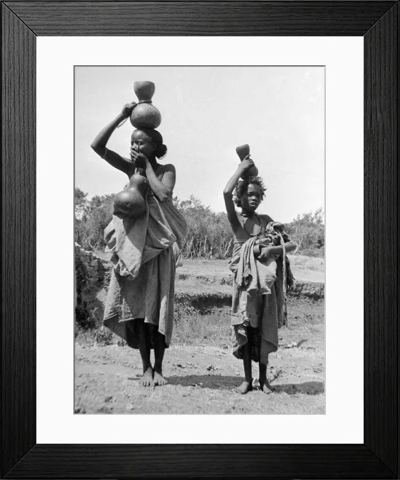 Framed Print : Children carrying water jars on the banks of the Nile near to Cairo Circa 1935