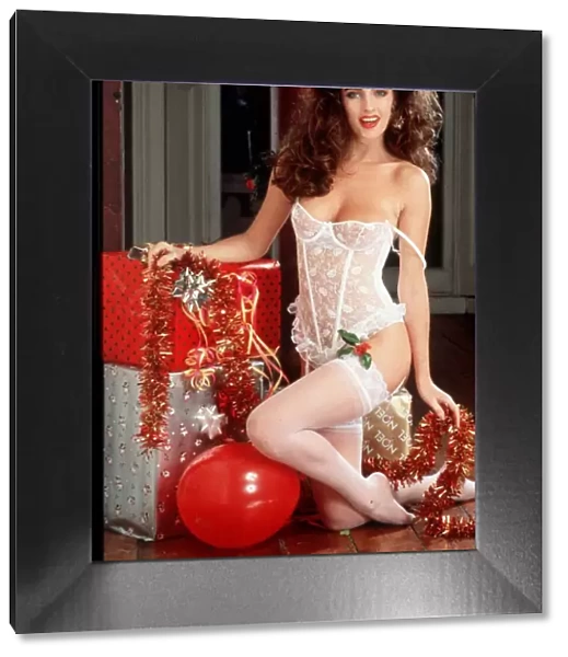 Christmas Model posing in white basque stockings and suspenders Underwear Leaning