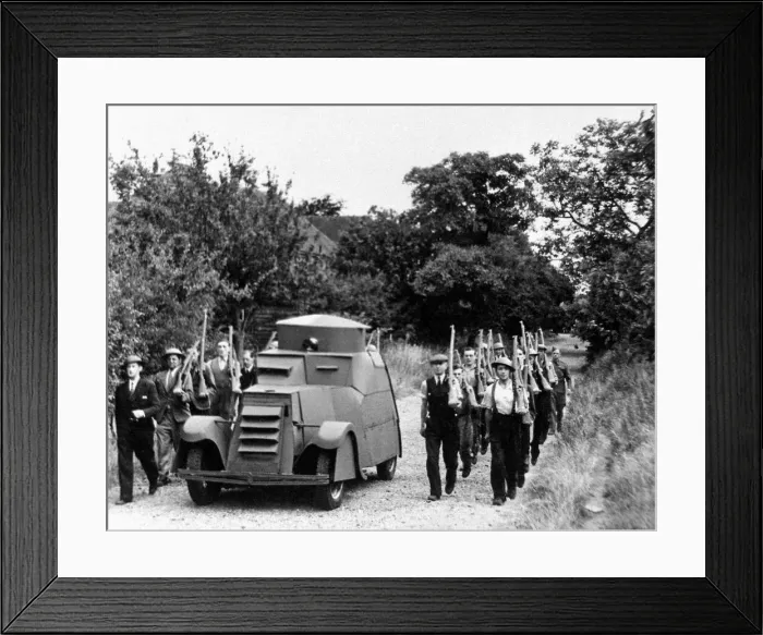 Framed Print : Workers at a Jam Factory march besides their own armoured car during a lunch break Framed Print : Workers at a Jam Factory march besides their own armoured car during a lunch break