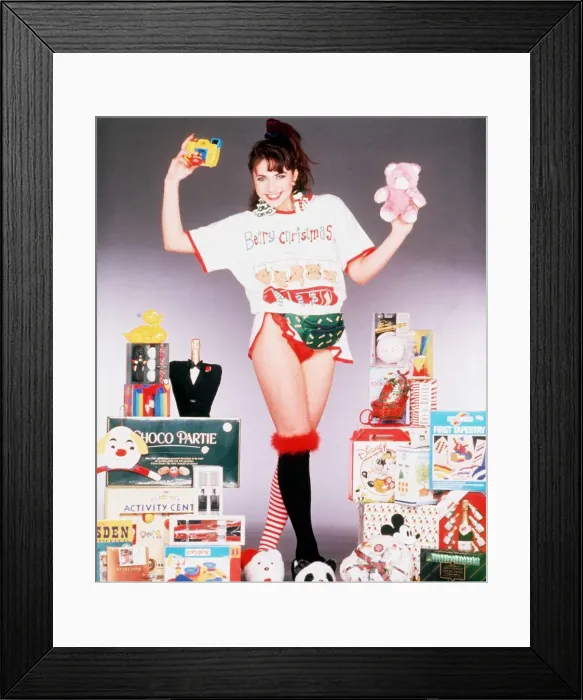Framed Print : Christmas model surrounded with present ideas for Christmas, 5th December 1989 Framed Print : Christmas model surrounded with present ideas for Christmas, 5th December 1989