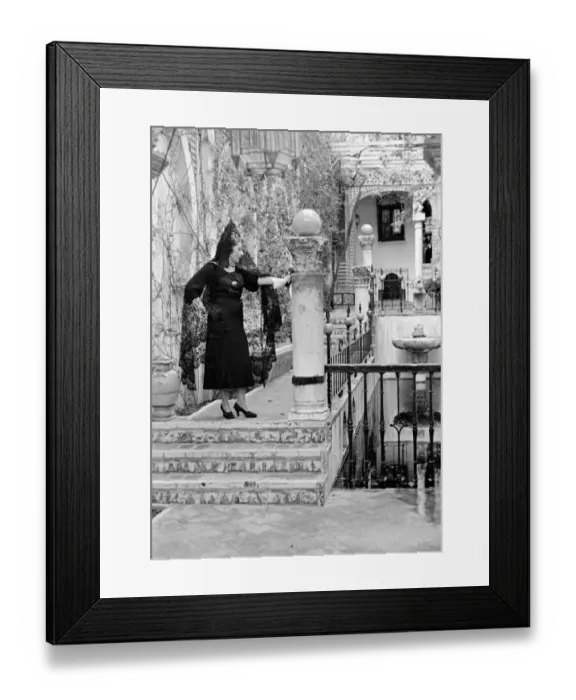 Framed Print : An Andalusian woman wearing black veil and standing on a balcony in Seville