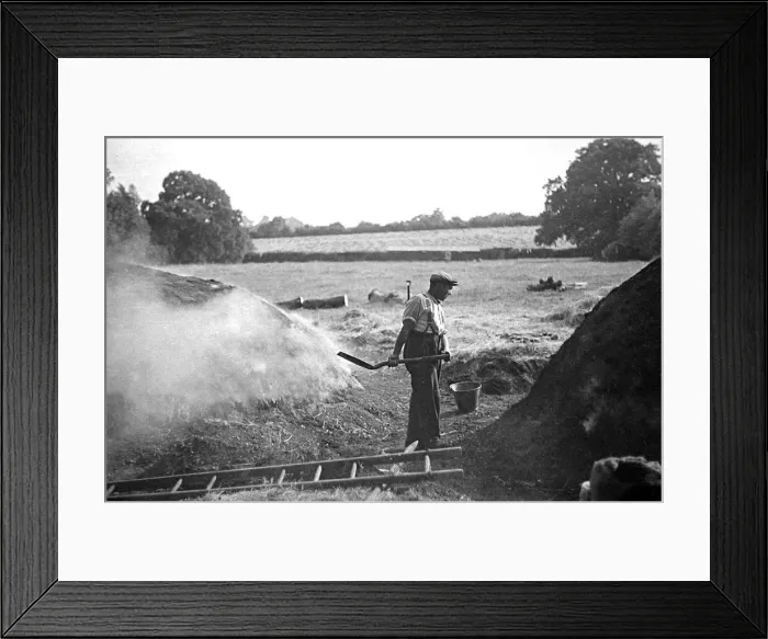 Framed Print : A farmer holding a shovel on a farm in England circa 1938 Framed Print : A farmer holding a shovel on a farm in England circa 1938