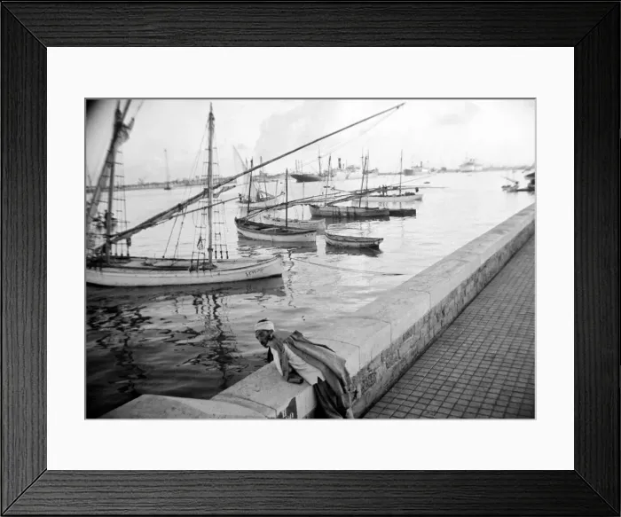 Framed Print : Local man looking at the boats in the harbour in Somaliland Circa 1935 Framed Print : Local man looking at the boats in the harbour in Somaliland Circa 1935