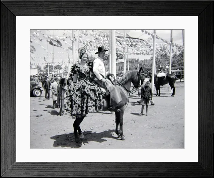 Framed Print : Local couple of Seville, Spain on horseback Circa 1935