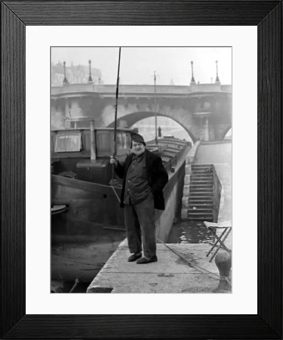 Framed Print : Paris street scenes - Man holding a fishing rod circa 1951 Framed Print : Paris street scenes - Man holding a fishing rod circa 1951