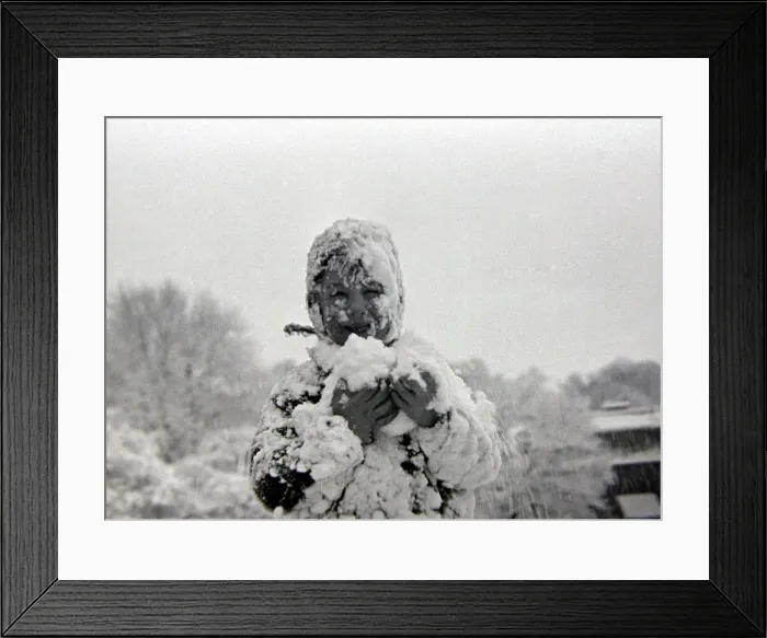 Framed Print : Child playing in the snow after a heavy fall at Hampstead Heath January 1945 Framed Print : Child playing in the snow after a heavy fall at Hampstead Heath January 1945