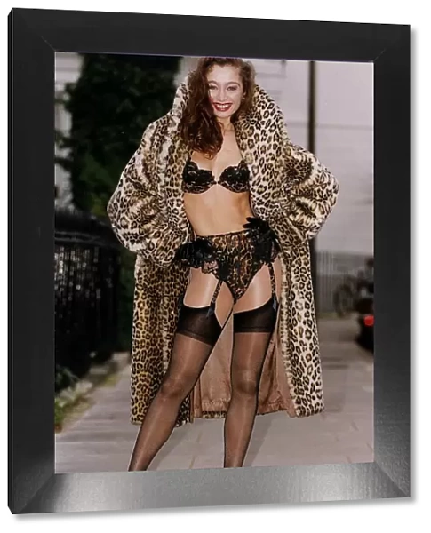 Donna Wilson model poses in Leopard skin fur coat revealing Janet Reger Leopard bra