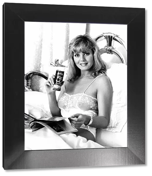 Ruth Gordon Model Sitting in bed reading and holding can of drink