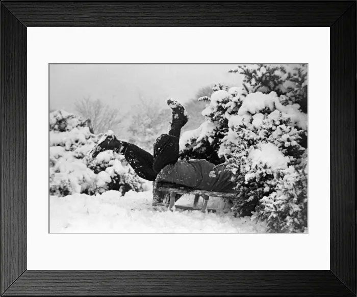 Framed Print : Children playing in the snow after a heavy fall at Hampstead Heath January Framed Print : Children playing in the snow after a heavy fall at Hampstead Heath January