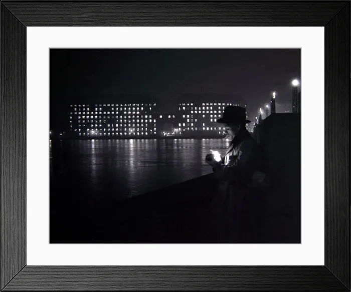 Framed Print : A man lights a cigarette on the Thames embankment in London Circa 1955 people Framed Print : A man lights a cigarette on the Thames embankment in London Circa 1955 people
