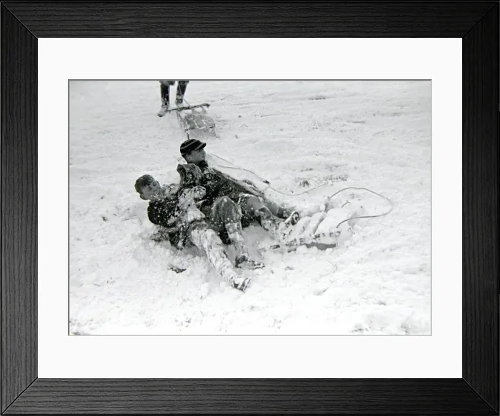 Framed Print : Children playing in the snow after a heavy fall at Hampstead Heath January 1945 Framed Print : Children playing in the snow after a heavy fall at Hampstead Heath January 1945