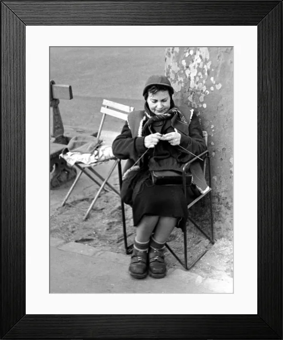 Framed Print : Paris street scenes - woman knitting circa 1951 Framed Print : Paris street scenes - woman knitting circa 1951