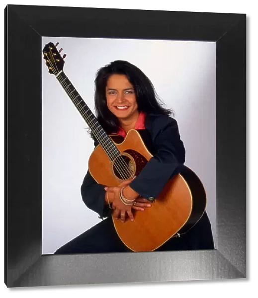 Carol Laula holding guitar September 1992