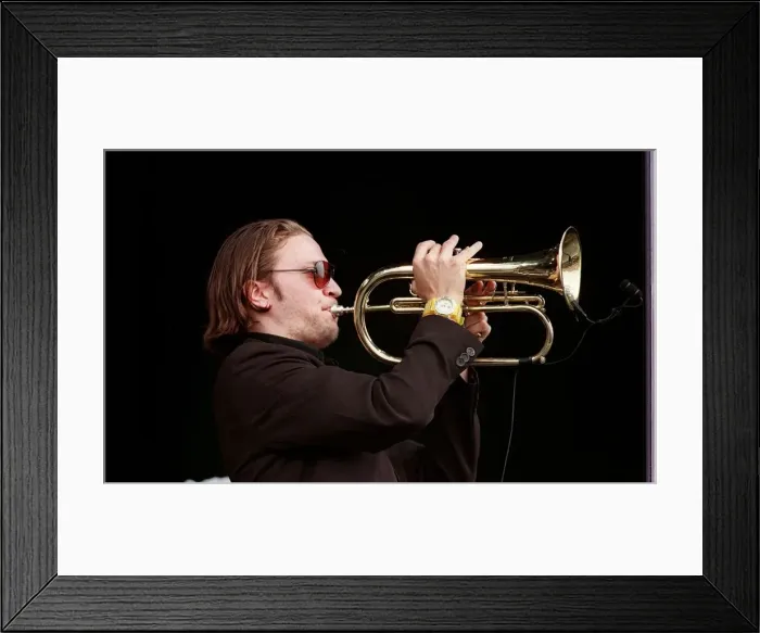 Framed Print : Member of the Fun Loving Criminals on stage playing the trumpet at T in the Park July Framed Print : Member of the Fun Loving Criminals on stage playing the trumpet at T in the Park July