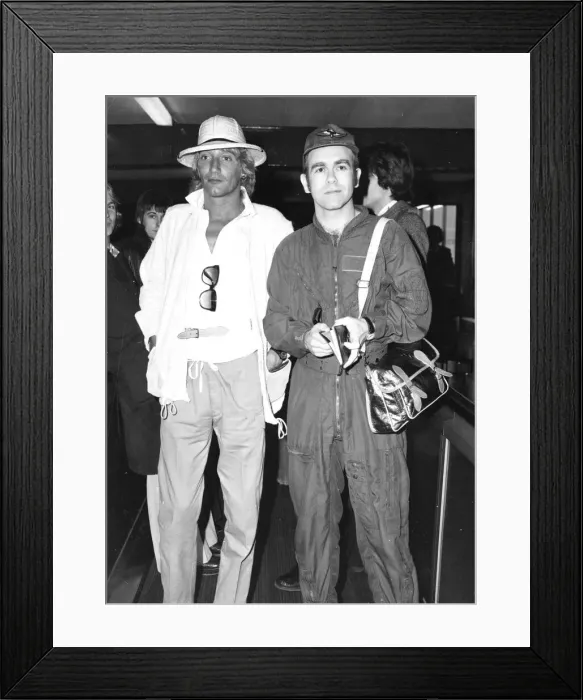 Framed Print : Rod Stewart and Elton John arriving at an airport. February 1978 Framed Print : Rod Stewart and Elton John arriving at an airport. February 1978