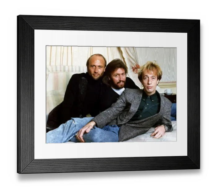 Framed Print : Bee Gees Pop Group brothers Maurice Gibb Barry Gibb & Robin Gibb together relax before