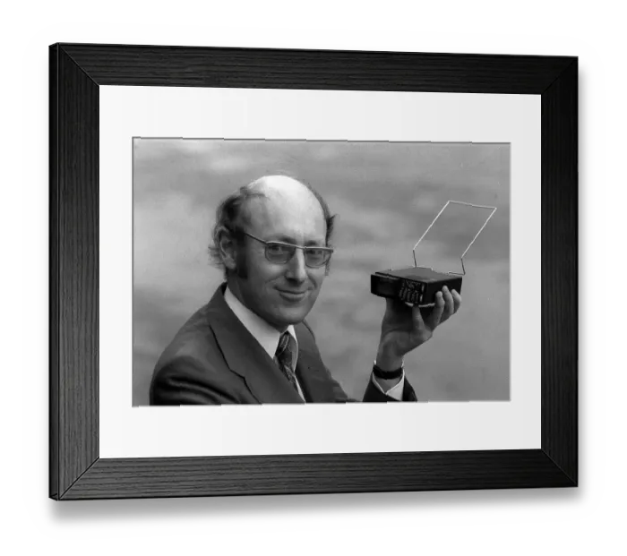 Framed Print : Clive Sinclair holding the first pocket sized television Framed Print : Clive Sinclair holding the first pocket sized television