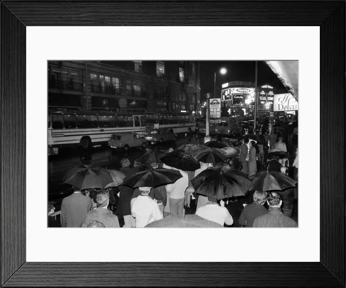 Framed Print : London travellers are soaked by the rain as the end of the 1976 drought is officially