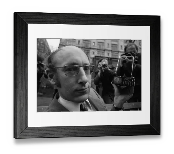 Framed Print : Clive Sinclair holding the first pocket sized television Framed Print : Clive Sinclair holding the first pocket sized television
