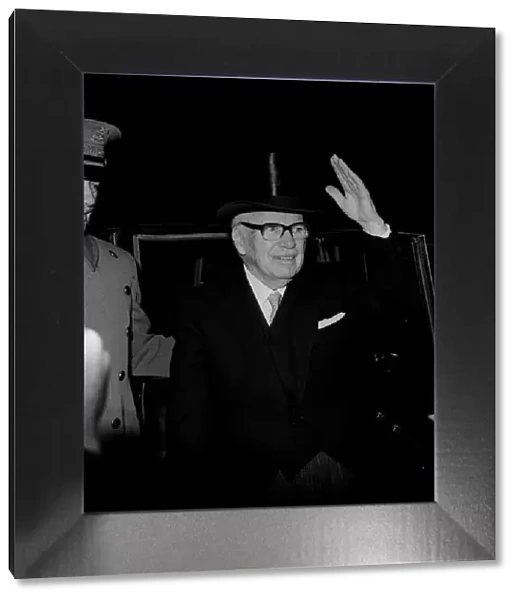 Charlie Chaplin waves after receiving his knighthood 1975