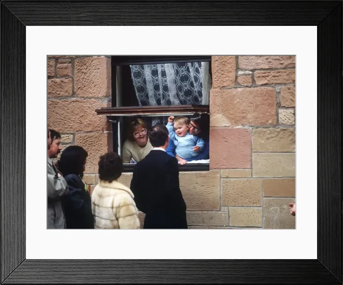 Framed Print : Prince Charles on a visit to Glasgow talking to family through window Framed Print : Prince Charles on a visit to Glasgow talking to family through window