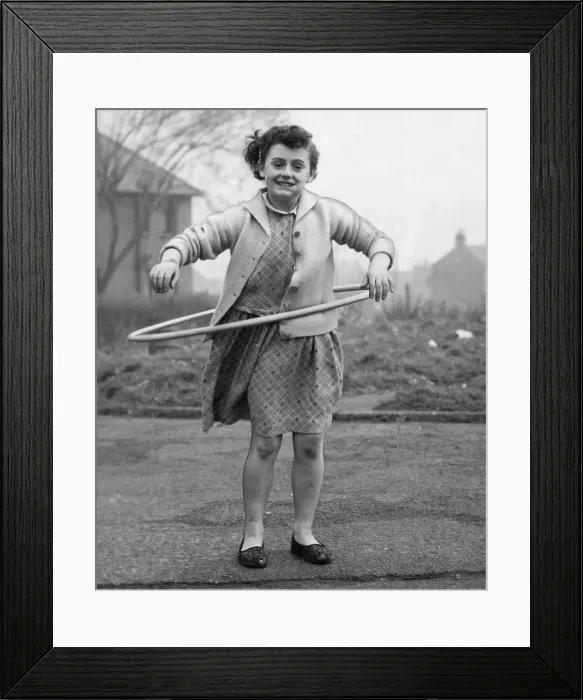 Framed Print : Joyce Wardle, aged 11, of Millfield Gardens, Felling spins her hula hoop Framed Print : Joyce Wardle, aged 11, of Millfield Gardens, Felling spins her hula hoop