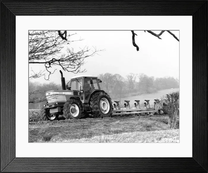 Framed Print : The Ford TW Tractor pulling a plough Framed Print : The Ford TW Tractor pulling a plough