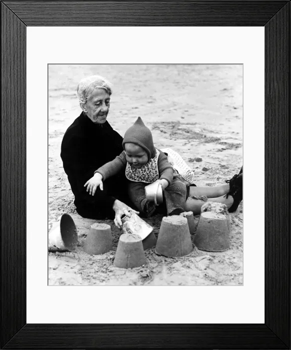 Framed Print : Grandma and grandson playing on beach August 1946 Framed Print : Grandma and grandson playing on beach August 1946