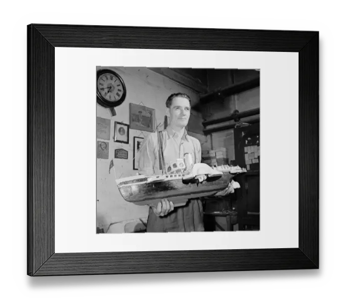 Framed Print : A blind model maker completes his latest model boat Circa 1957