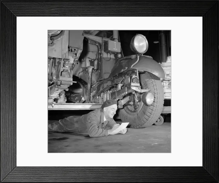 Framed Print : London Transport mechanics seen here checking the engine of a Leyland bus