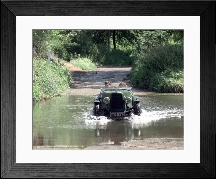 Framed Print : A vintage car passes through the ford at Coughton near Alcester Framed Print : A vintage car passes through the ford at Coughton near Alcester