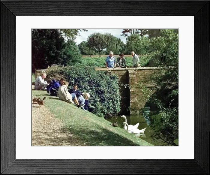 Framed Print : The moated manor house Baddesley Clinton, Warwickshire. Visitors with swans Framed Print : The moated manor house Baddesley Clinton, Warwickshire. Visitors with swans