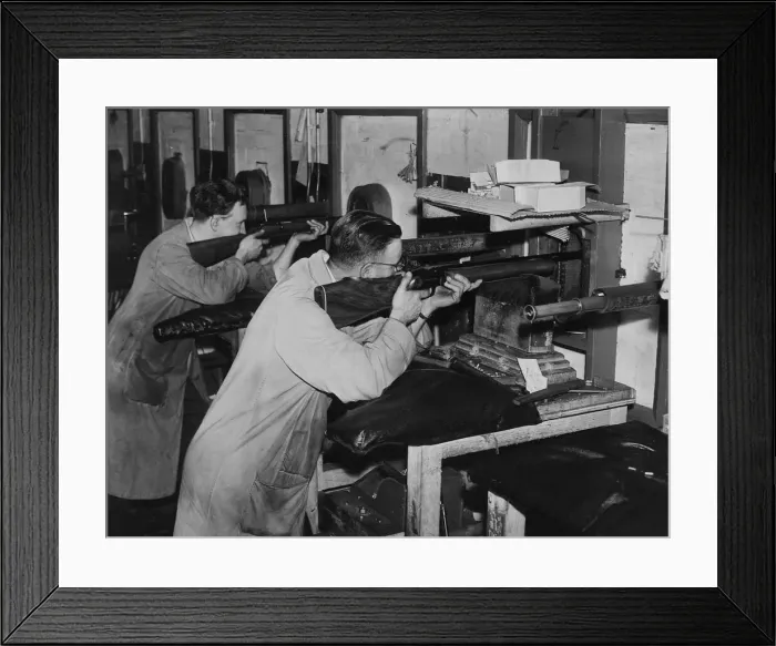 Framed Print : George Bicknell and Bill Moore are seen on the range testing rifles