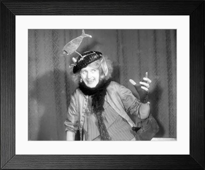 Framed Print : Woman wearing a hat with a fish on it. Singer performing on stage