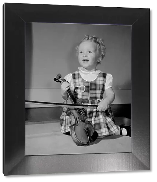 A small girl with her violin Circa 1957